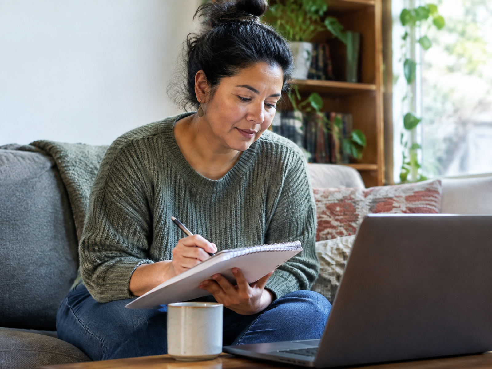 A woman reviewing notes while choosing a Maryland therapist