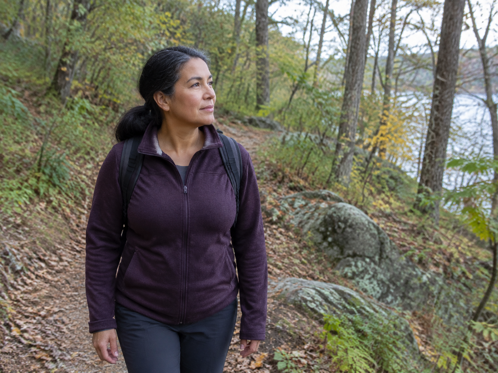 A woman taking a quiet walk on a wooded Maryland trail